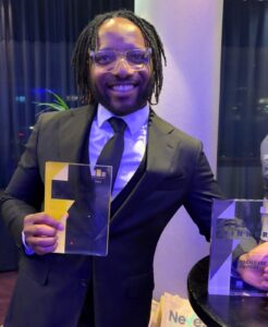 Elvis Idegbekwu celebrating with his awards at the SME MK and Buckinghamshire Business Awards 2026